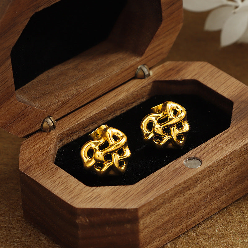 Boucle d'oreille d'acier inoxydable de coeur enroulé