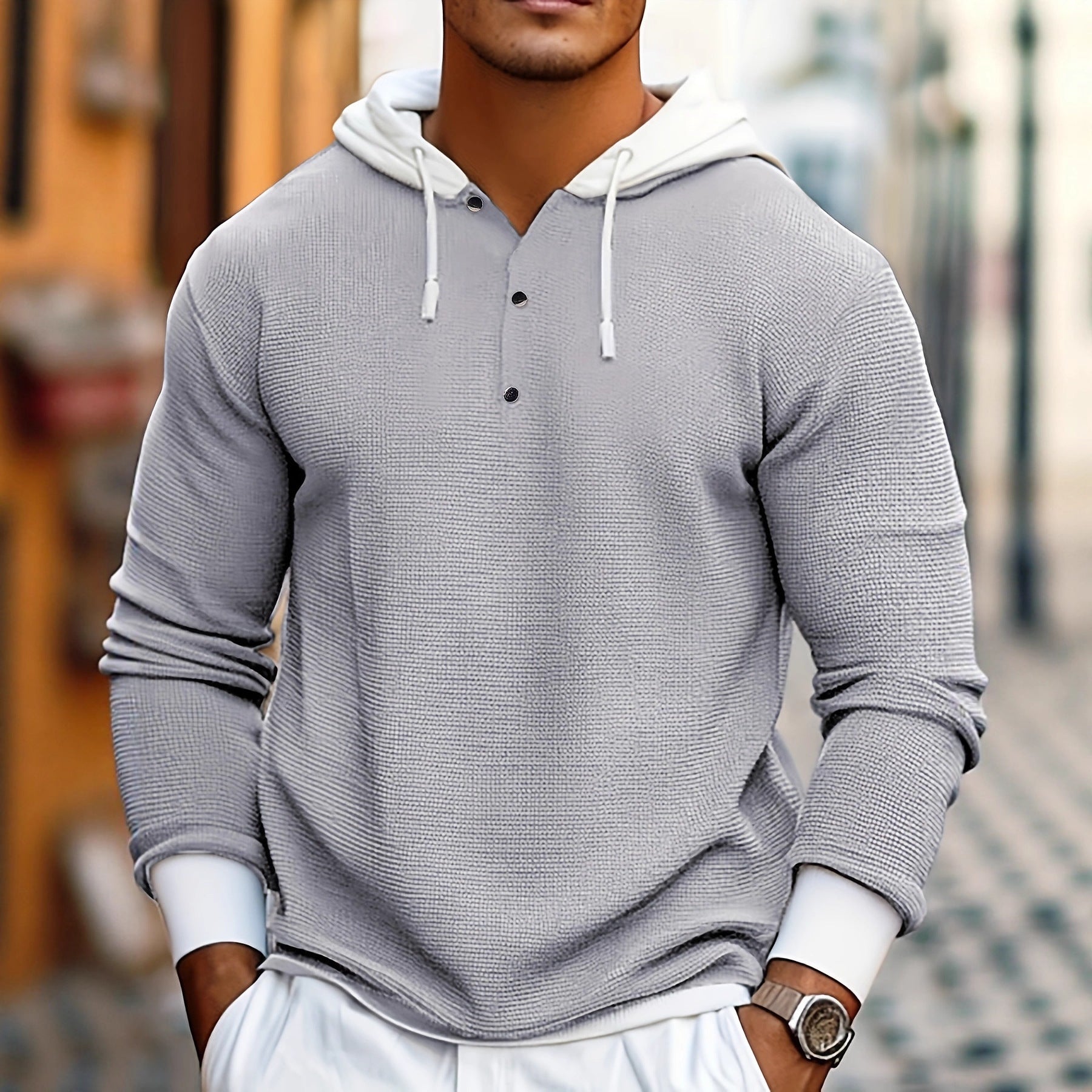 Sweat à capuche casual automne-hiver en maille gaufrée, manches longues, coloris contrastés, avec boutons.