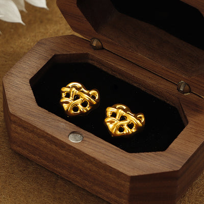 Boucle d'oreille d'acier inoxydable de coeur enroulé